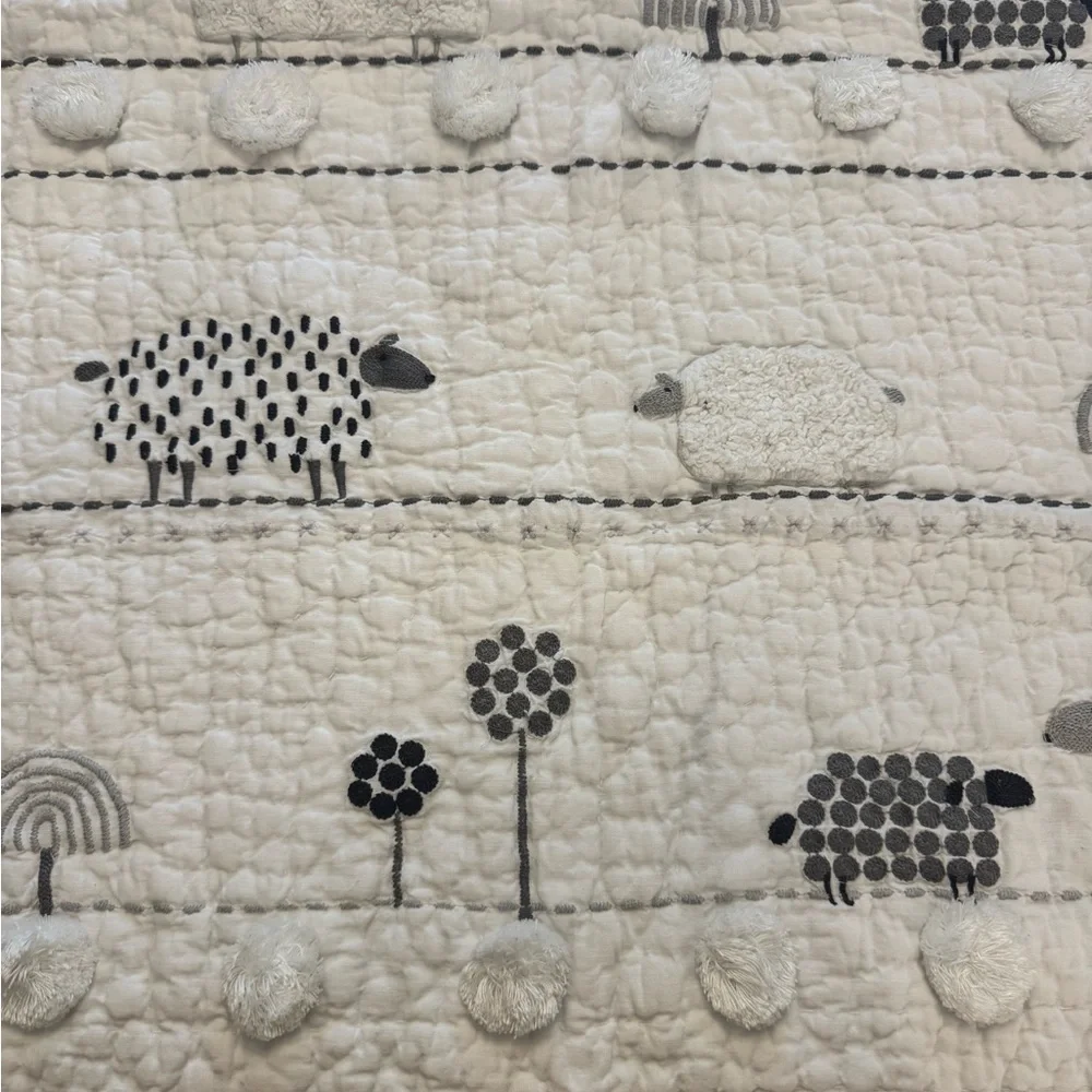 Pottery Barn Kids Shelby Sheep Baby Quilt features textured Sherpa sheep